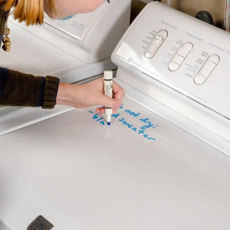 escribiendo notas en la lavadora HH