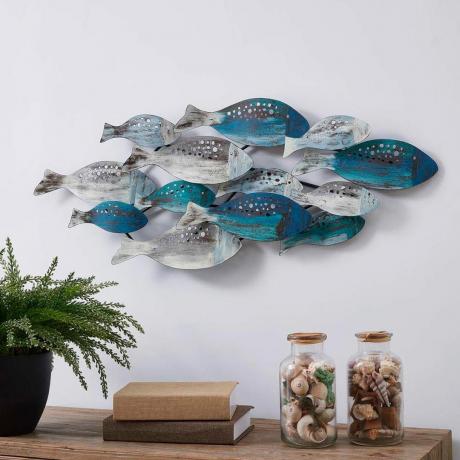 escultura de pared de pez azul