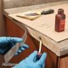 Tips til reparation af laminat: Reglue Loose Laminate (DIY)