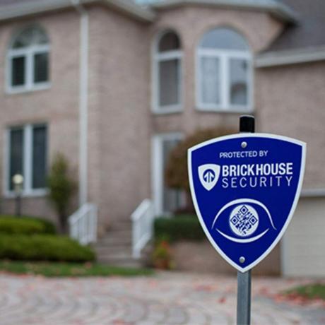 Ķieģeļu mājas drošības zilā vairoga mājas uzraudzības pagalma zīme